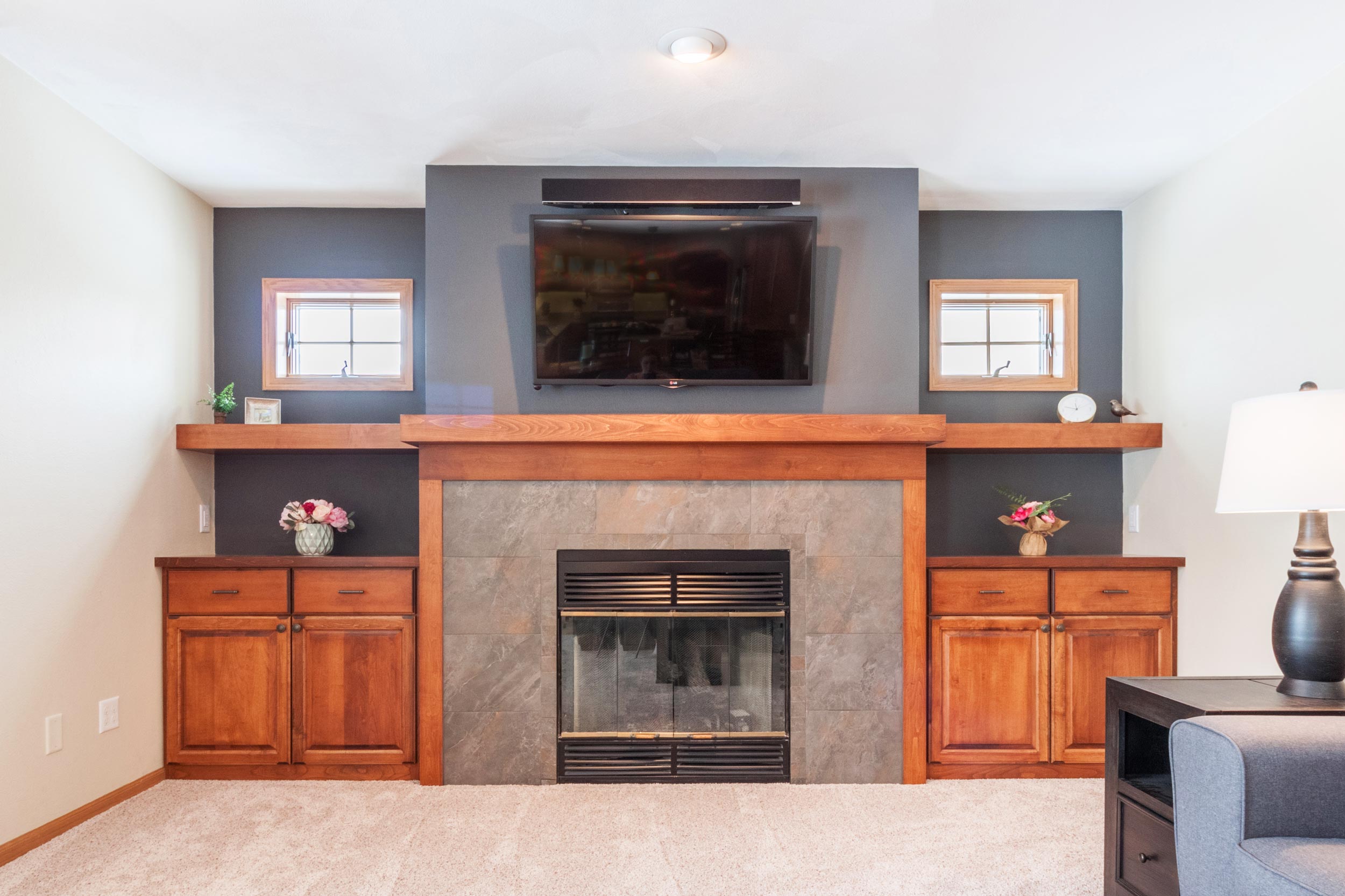 Professional TV Mounting Birmingham AL - Fireplace Installation Professional TV Mounting Birmingham AL - Expert technician installing a TV above fireplace